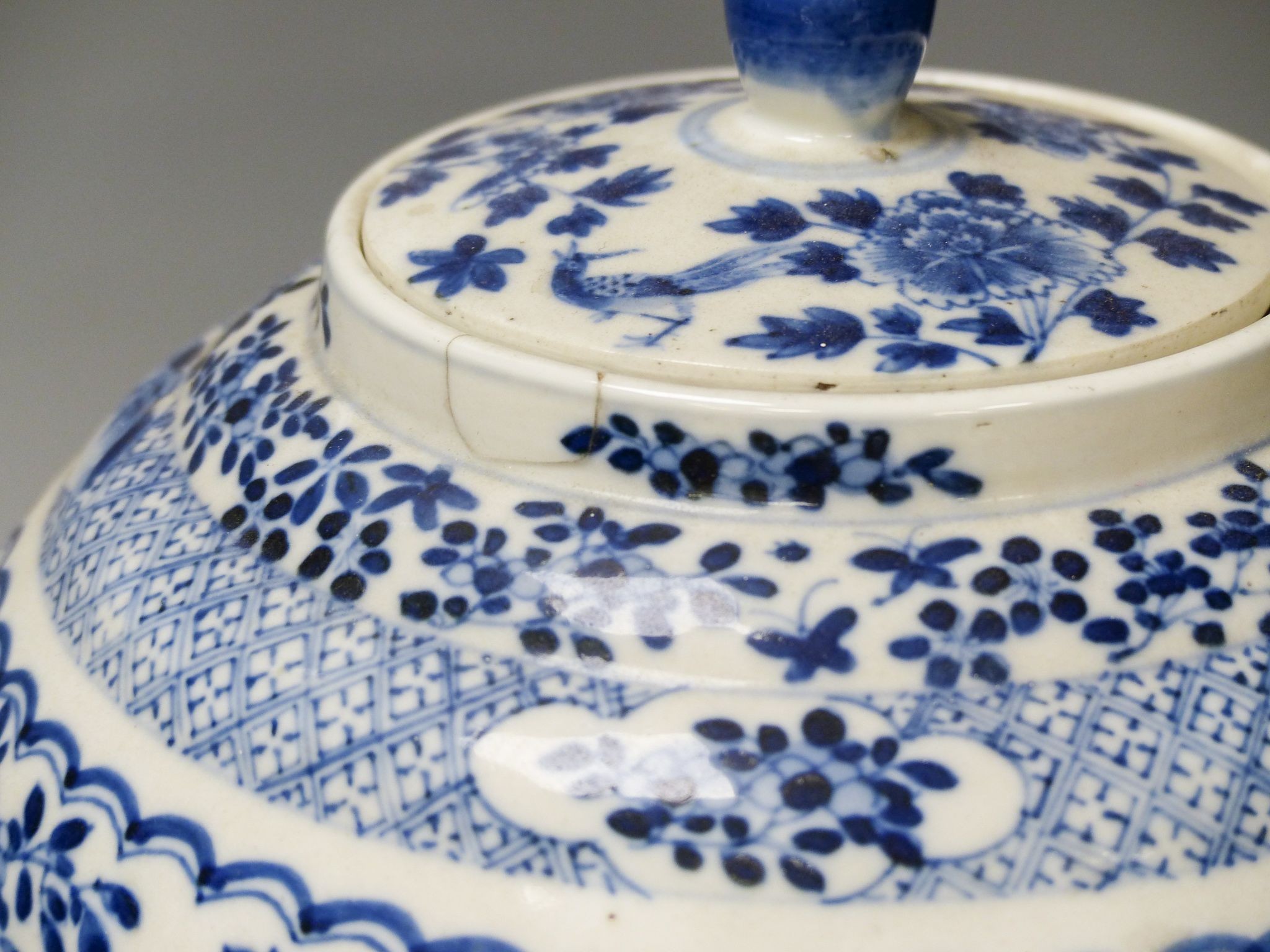 A 19th century Chinese blue and white jar and cover, four character Kangxi mark, 22cm high and a Chinese blue and white fan shape dish, 25.5cm